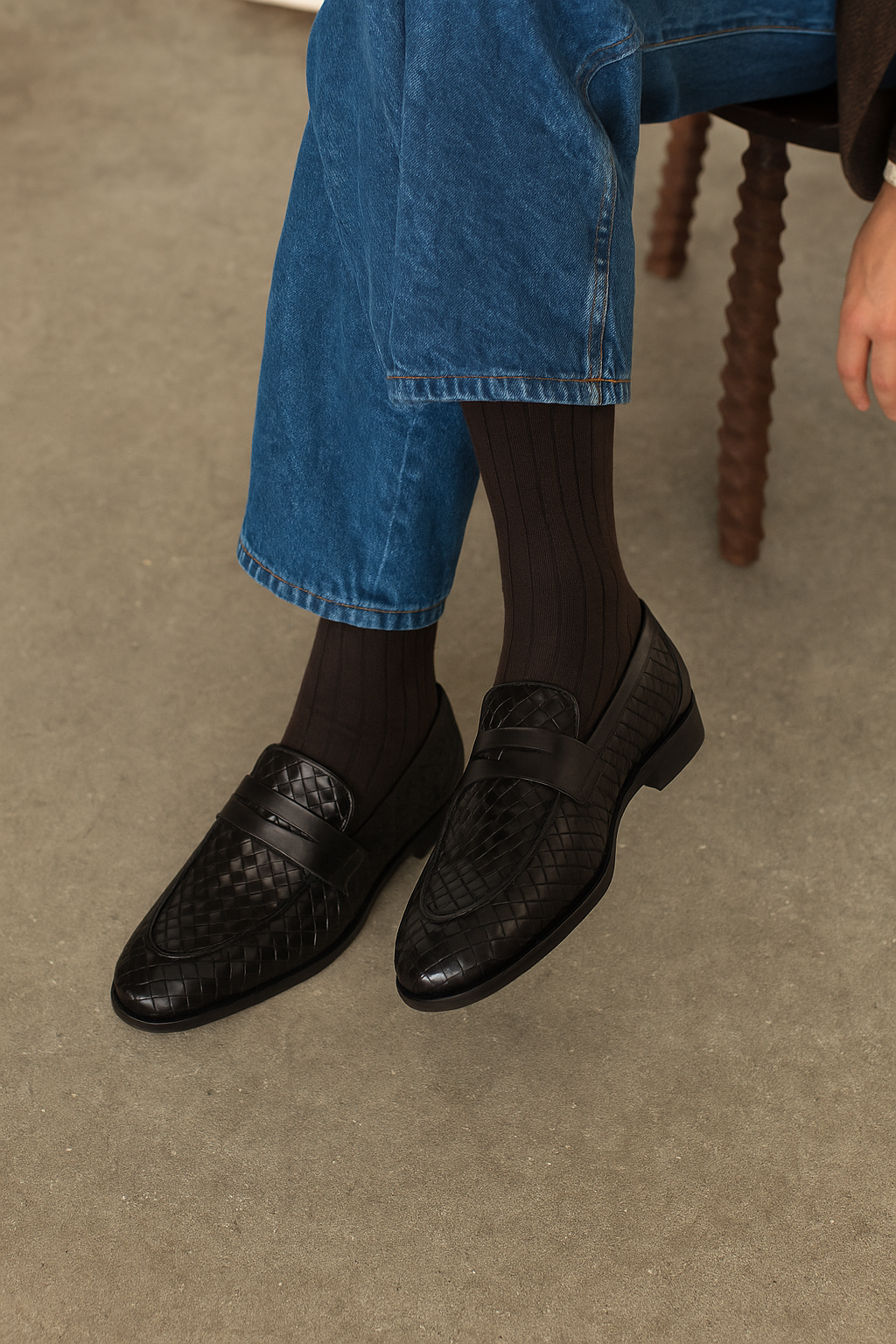 The BELVEDERE Belvedere - Luca Woven Calf Penny Loafer in black, crafted from Italian calf leather with a low heel and round toe, is photographed from the side on a white background.