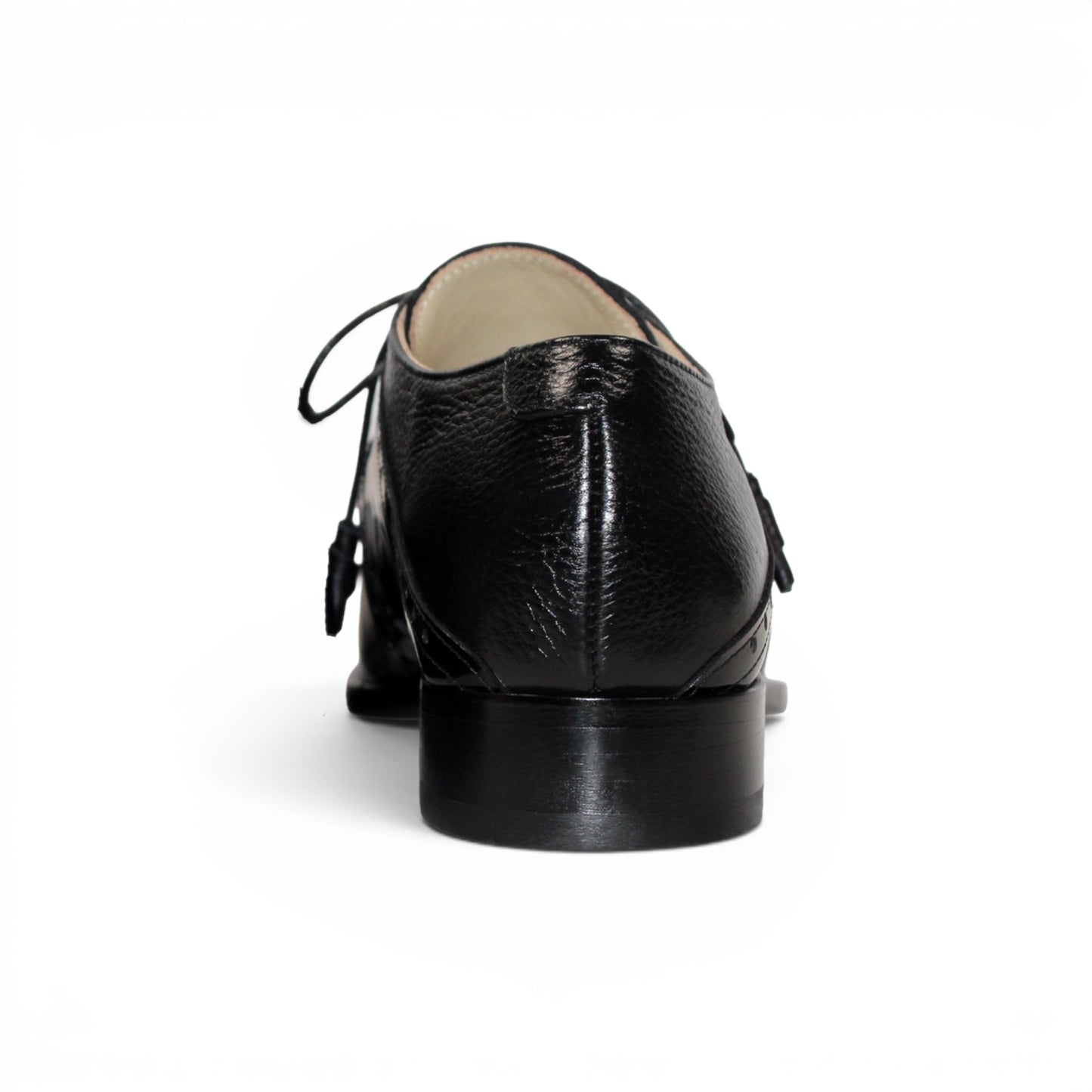 The Emilio Franco Luciano Black by Emilio Franco is an elegant men's dress shoe crafted from premium Italian leather, featuring a closed lacing system, low heel, and decorative perforations on the toe. Shown in profile against a plain white background, this luxury footwear exemplifies refined style.