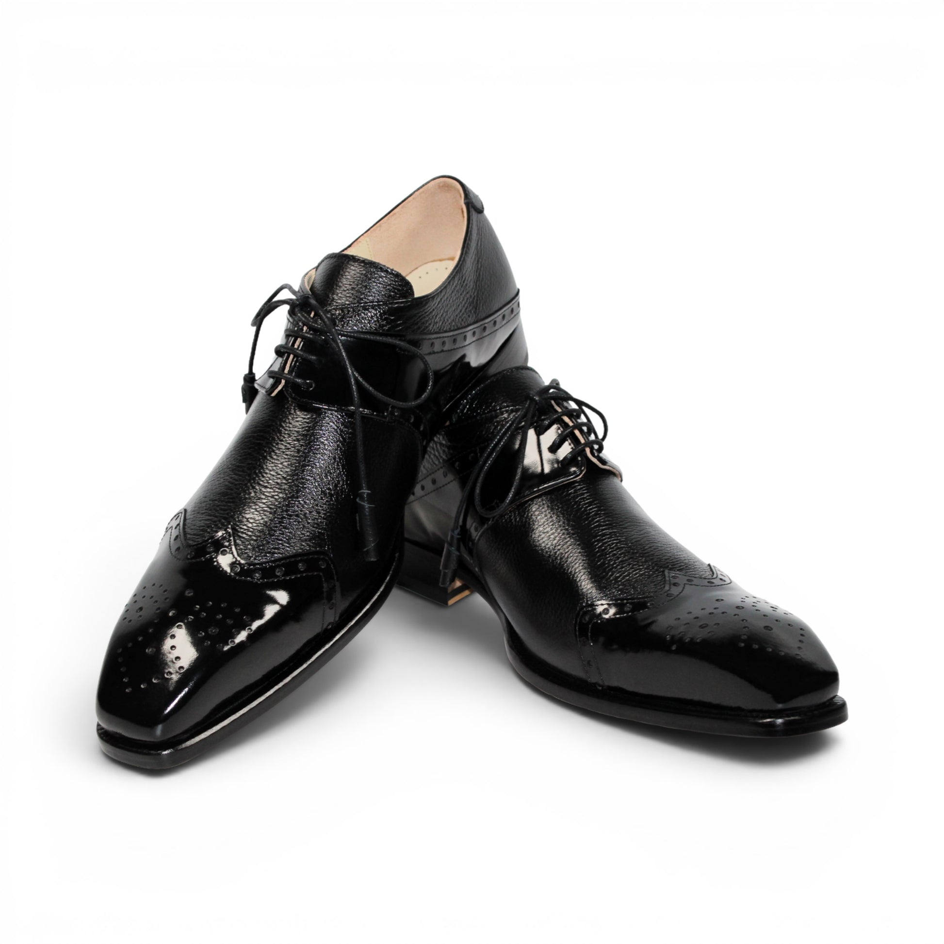 The Emilio Franco Luciano Black by Emilio Franco is an elegant men's dress shoe crafted from premium Italian leather, featuring a closed lacing system, low heel, and decorative perforations on the toe. Shown in profile against a plain white background, this luxury footwear exemplifies refined style.