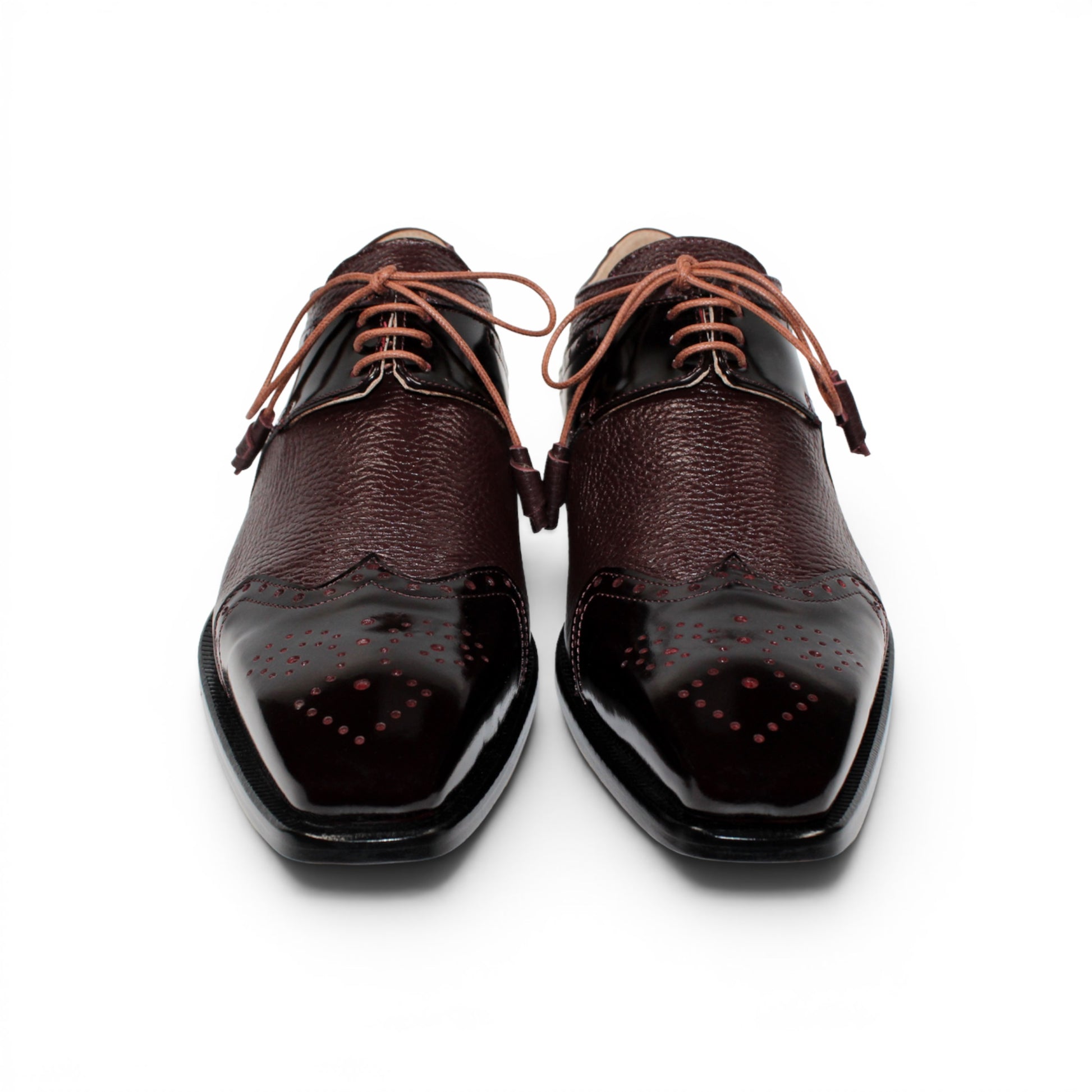 An Emilio Franco Luciano Burgundy oxford shoe, crafted from premium leather in a rich burgundy shade, features laces, classic wingtip detailing, and a polished finish on the toe and side panels, displayed in profile against a white background.