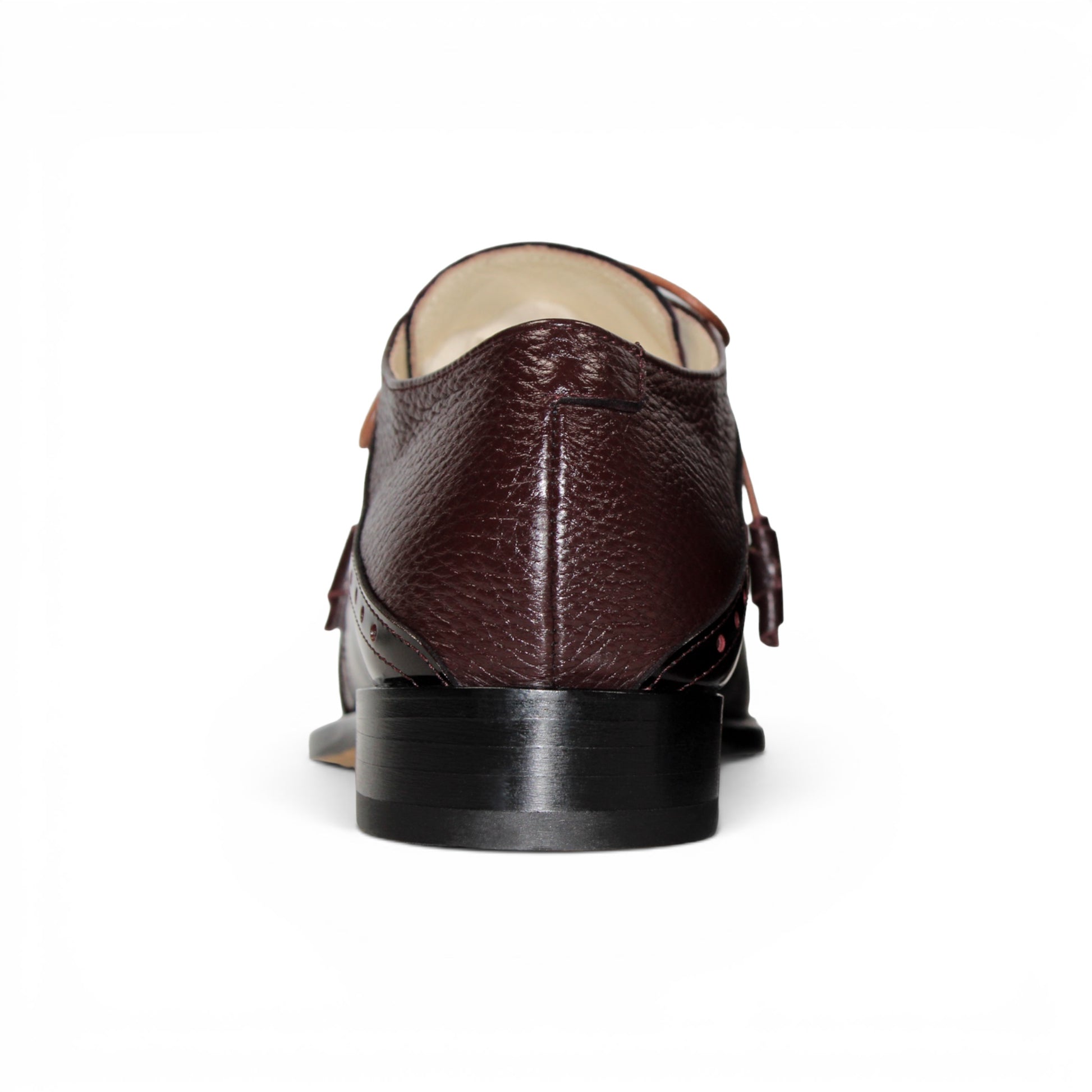 An Emilio Franco Luciano Burgundy oxford shoe, crafted from premium leather in a rich burgundy shade, features laces, classic wingtip detailing, and a polished finish on the toe and side panels, displayed in profile against a white background.