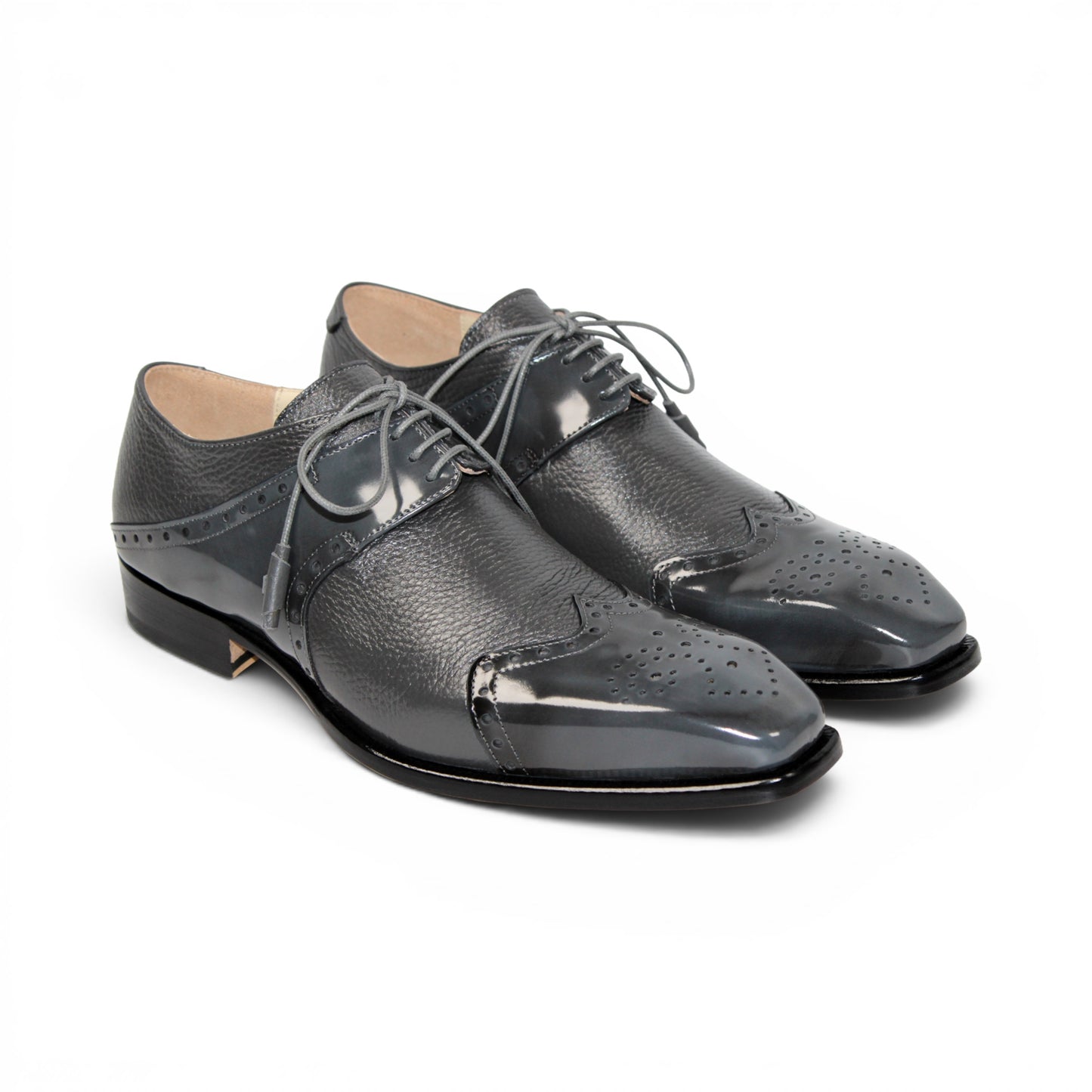 The Emilio Franco Luciano Grey dress shoe by Emilio Franco is shown in profile on a white background: this single gray leather shoe features laces, a glossy toe cap, and subtle decorative perforations—exemplifying the refinement of luxury men's footwear crafted from genuine deerskin.