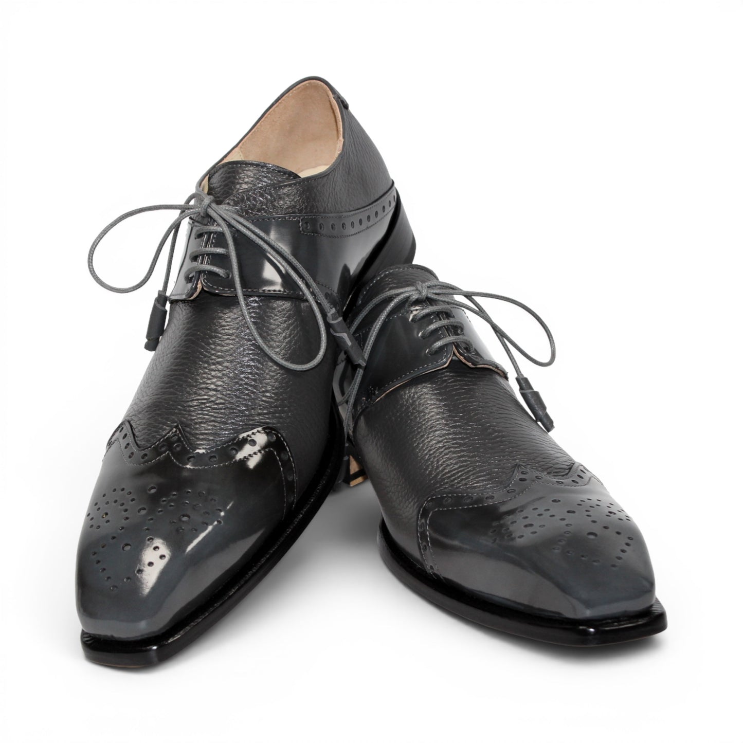 The Emilio Franco Luciano Grey dress shoe by Emilio Franco is shown in profile on a white background: this single gray leather shoe features laces, a glossy toe cap, and subtle decorative perforations—exemplifying the refinement of luxury men's footwear crafted from genuine deerskin.