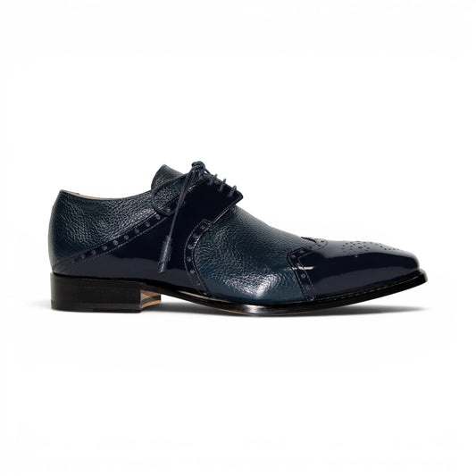 The Emilio Franco Luciano Navy by Emilio Franco is a luxury men's shoe in dark blue Italian leather, featuring brogue detailing, laces, and a low black heel, displayed on a white background.