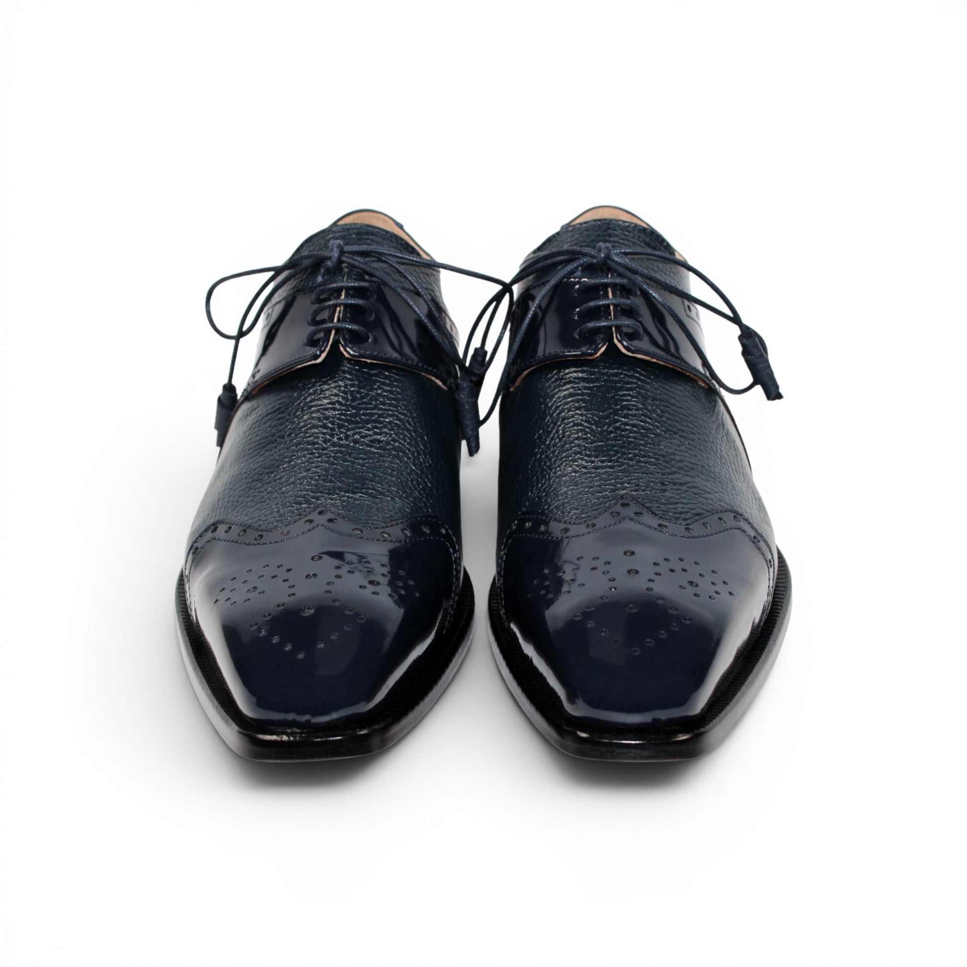 The Emilio Franco Luciano Navy by Emilio Franco is a luxury men's shoe in dark blue Italian leather, featuring brogue detailing, laces, and a low black heel, displayed on a white background.