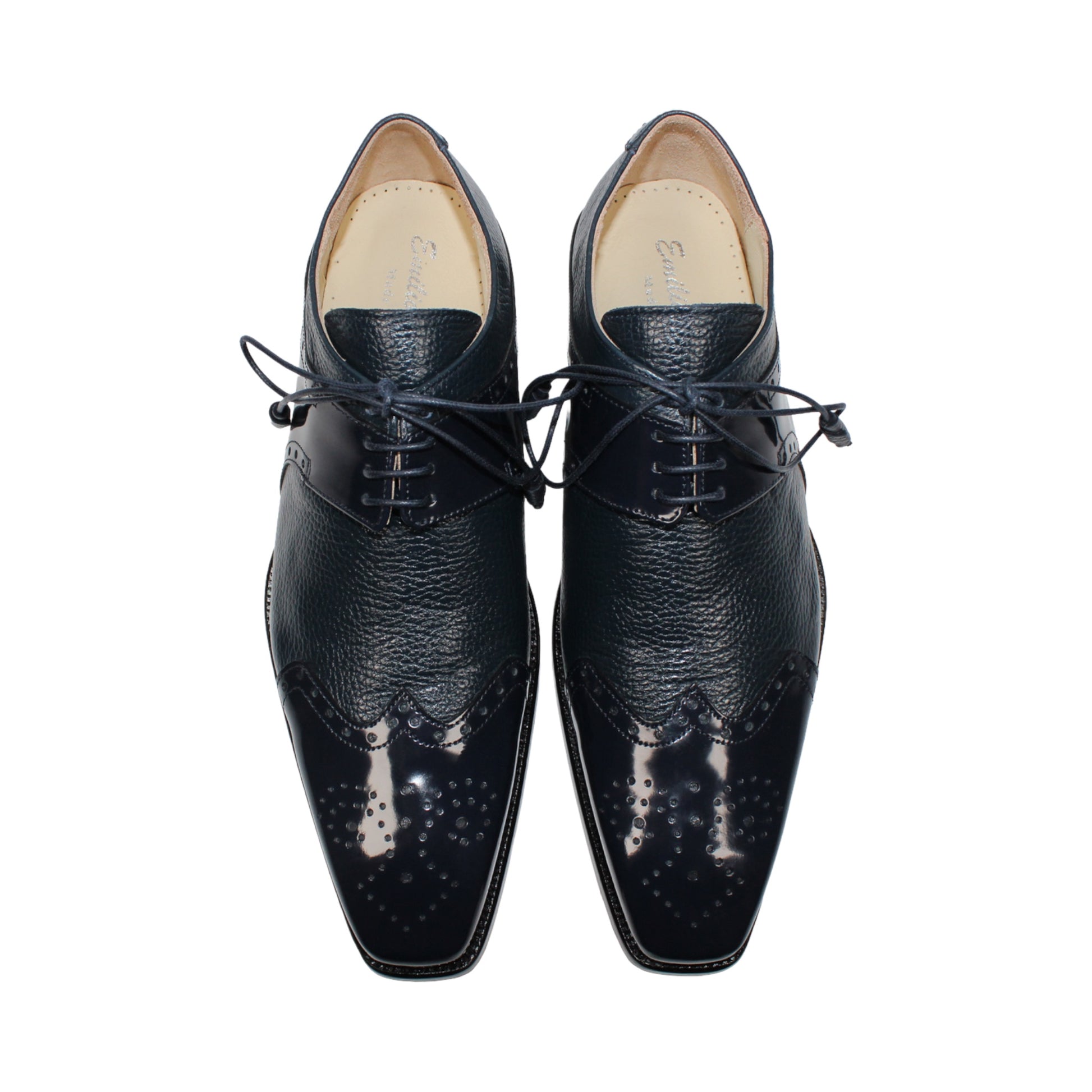 The Emilio Franco Luciano Navy by Emilio Franco is a luxury men's shoe in dark blue Italian leather, featuring brogue detailing, laces, and a low black heel, displayed on a white background.