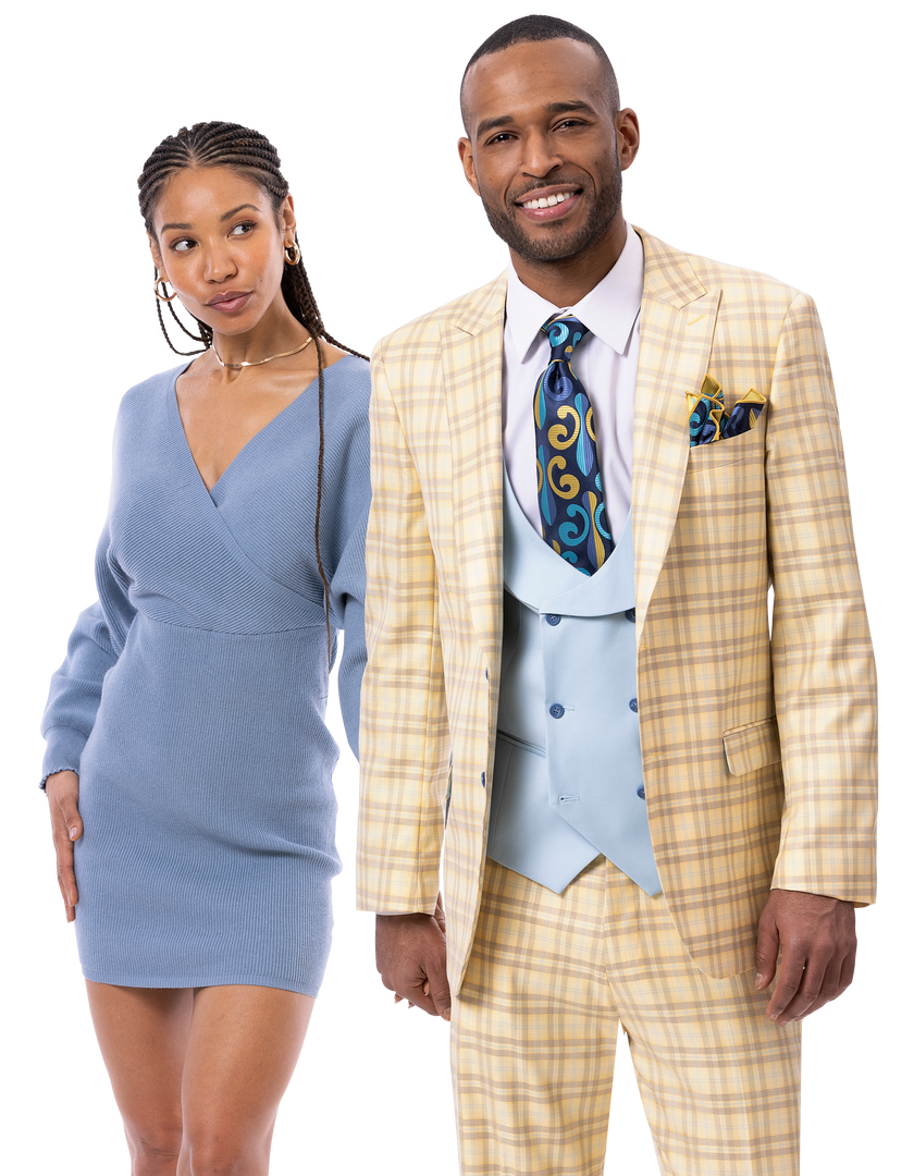 A woman in a light blue dress stands next to a man wearing the EJ Samuel Tan/Blue Suit M2807, which includes a striking yellow plaid jacket and pants, paired with a coordinating vest and blue tie by EJ SAMUEL.