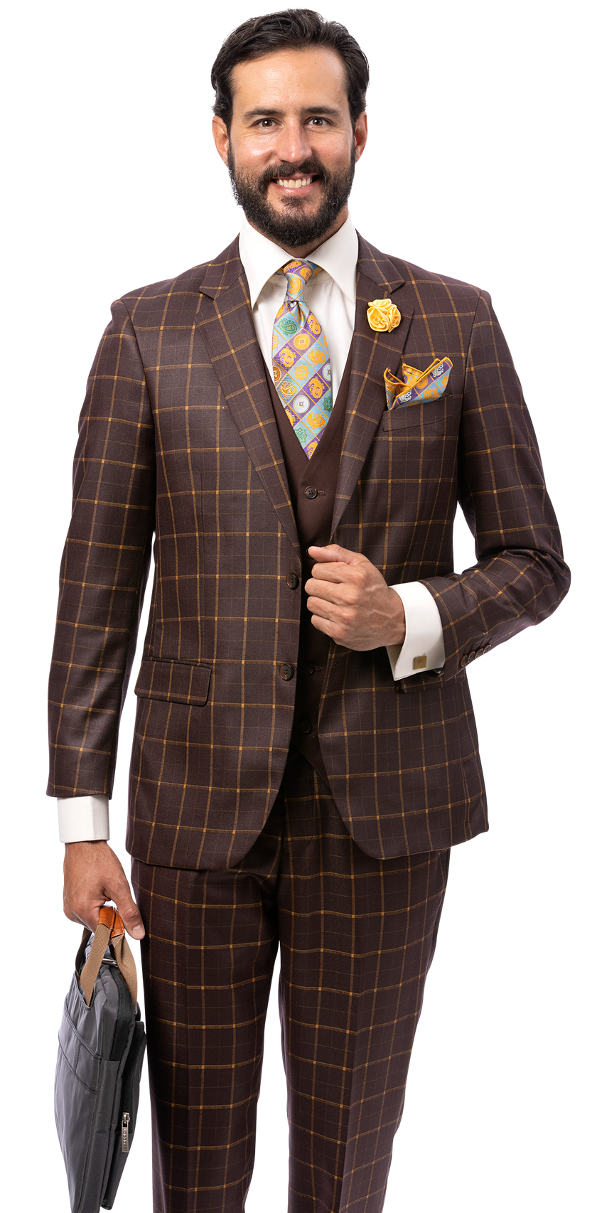 A man wearing the EJ Samuel Brown Suit M2817 by EJ SAMUEL, paired with a vibrant tie and pocket square, holds a gray bag and smiles while standing against a plain white background.