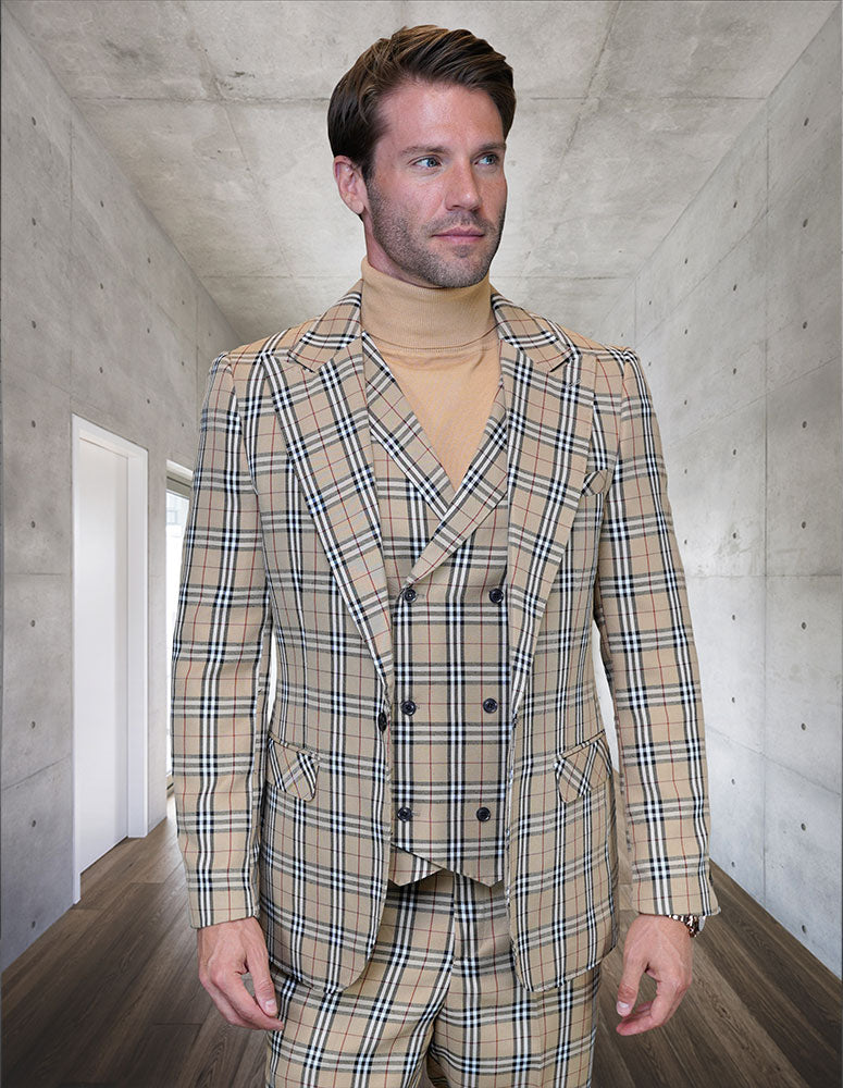A man stands in a modern hallway wearing the STATEMENT CLOTHING | MASSARI-TAN suit by Statement Clothing, featuring Italian wool in beige plaid with a double-breasted vest and matching turtleneck for a refined, modern look.