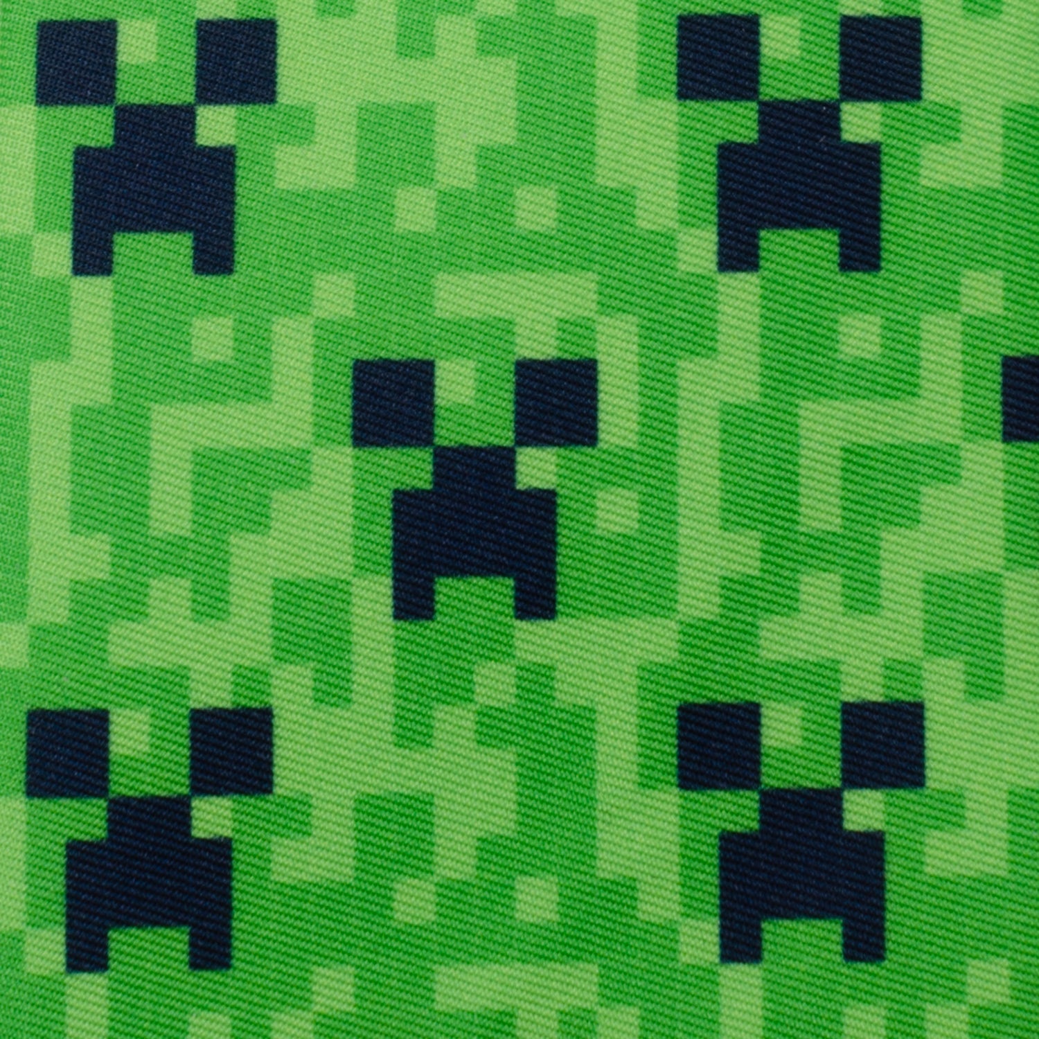 The Minecraft Creeper Green Boy's Tie by Cufflinks.com features a pixelated green design inspired by the iconic Creeper face from the video game Minecraft.
