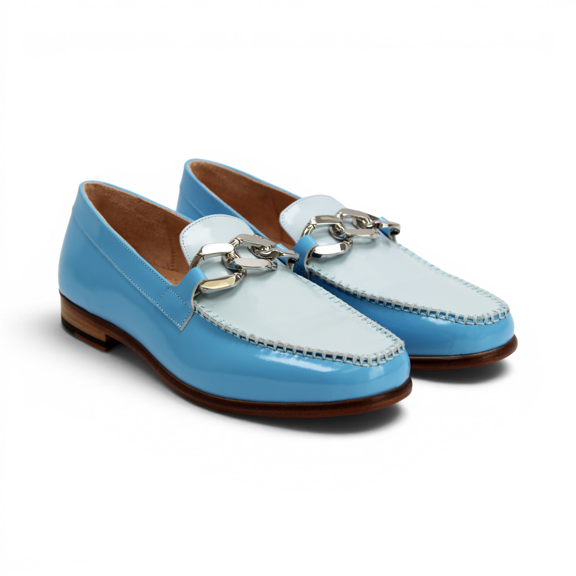 The Emilio Franco M2 Light Blue is a shiny light blue genuine leather loafer by Emilio Franco, featuring a silver decorative buckle on top and a classic leather sole, displayed on a flat white background.