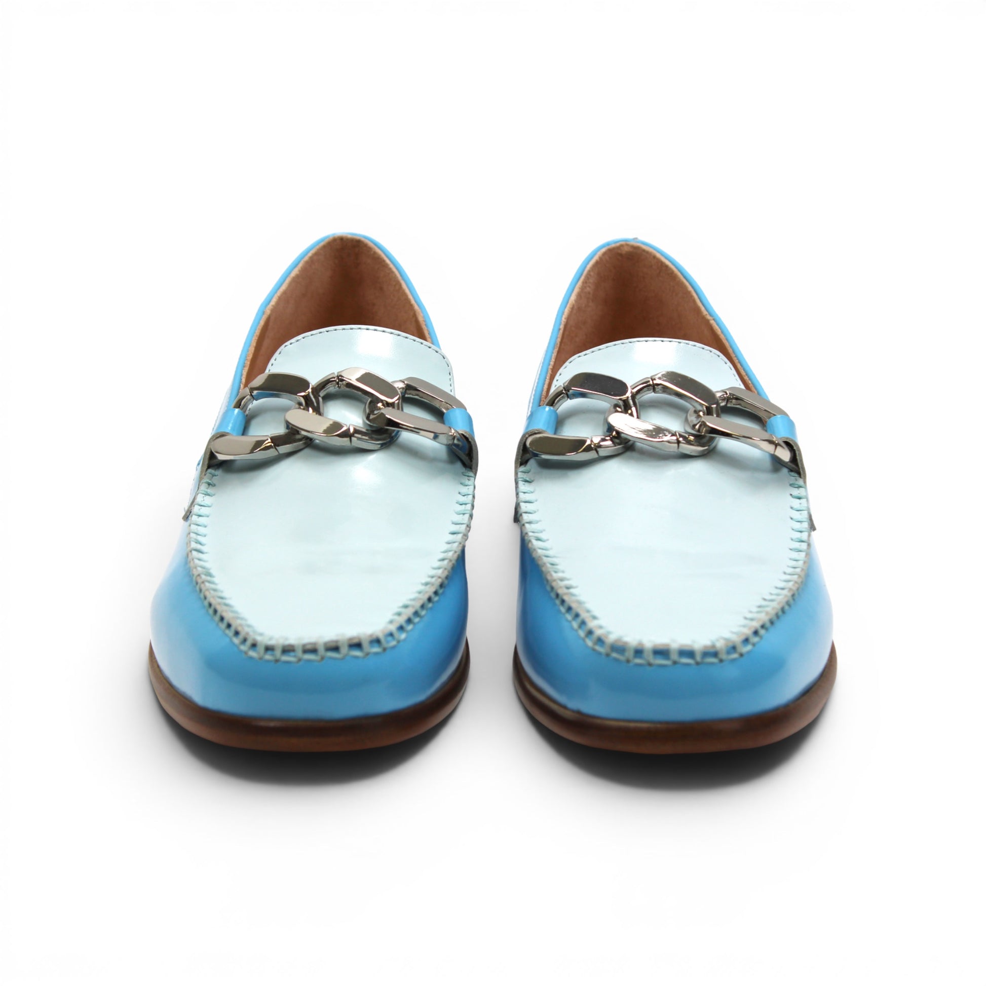 The Emilio Franco M2 Light Blue is a shiny light blue genuine leather loafer by Emilio Franco, featuring a silver decorative buckle on top and a classic leather sole, displayed on a flat white background.