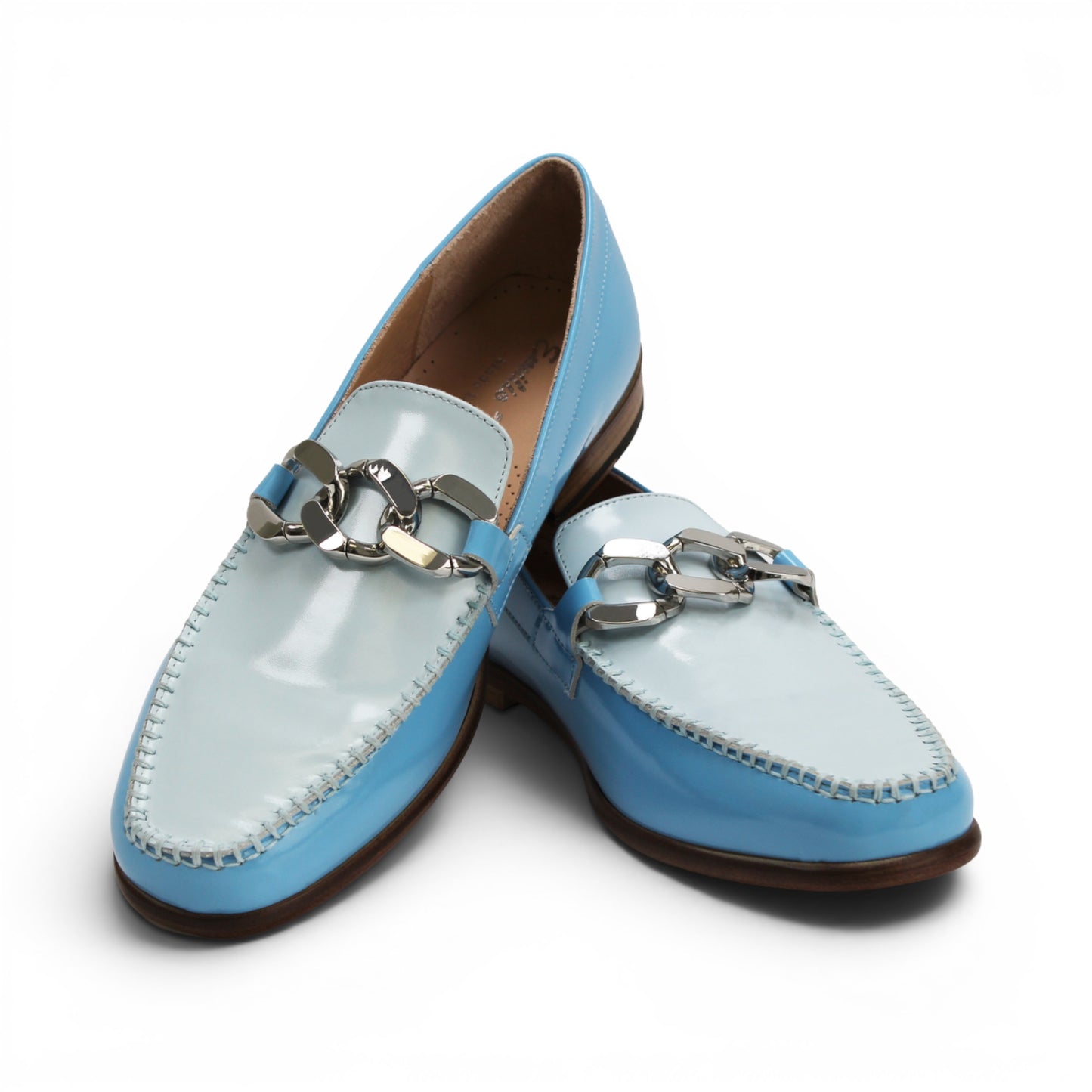 The Emilio Franco M2 Light Blue is a shiny light blue genuine leather loafer by Emilio Franco, featuring a silver decorative buckle on top and a classic leather sole, displayed on a flat white background.