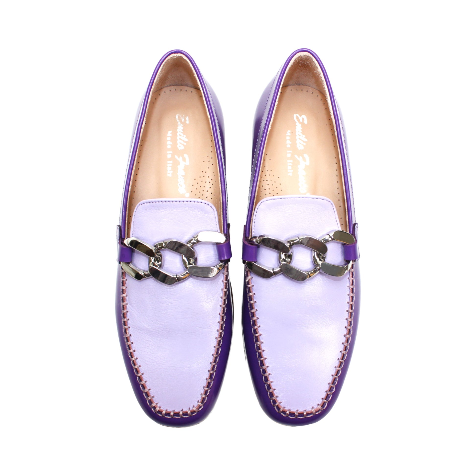 The Emilio Franco M2 Purple/Lavender loafer is an Italian-crafted shoe featuring white stitching, a metal chain detail on the upper, and a brown wooden sole.