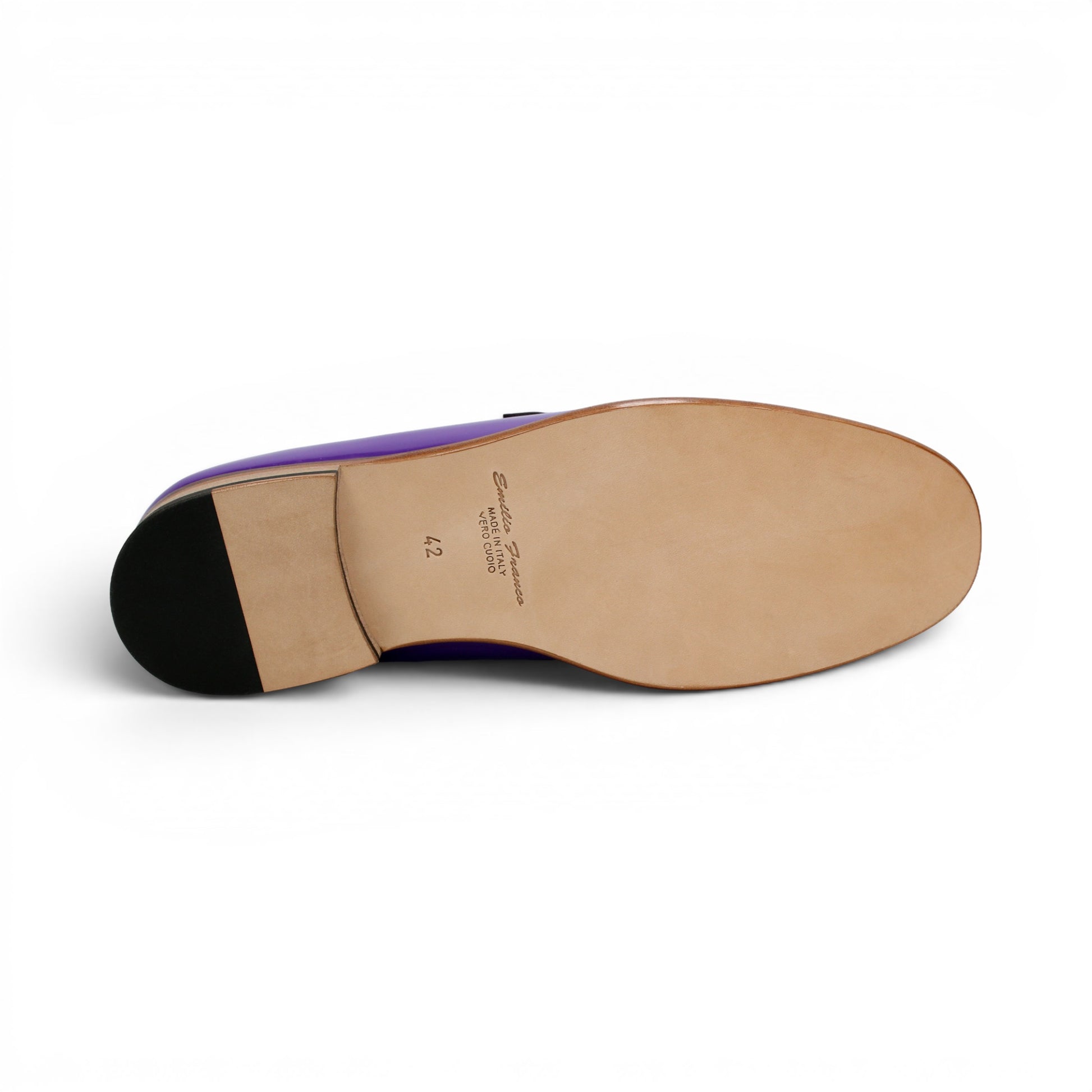 The Emilio Franco M2 Purple/Lavender loafer is an Italian-crafted shoe featuring white stitching, a metal chain detail on the upper, and a brown wooden sole.