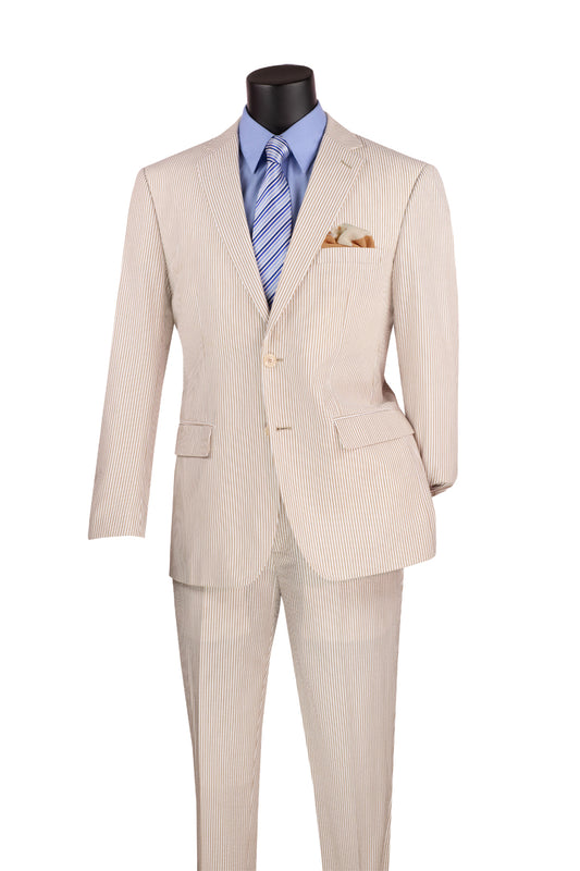 A Vinci Suits mannequin displays the Modern Fit Summer 2 Piece Seersucker Tan suit, paired with a blue dress shirt, striped tie, and a gold pocket square.