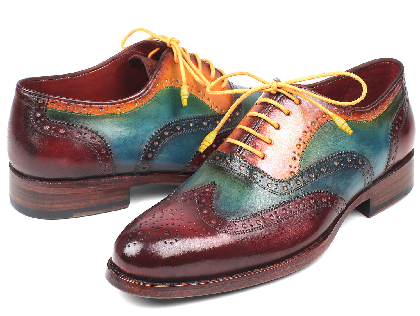 The Paul Parkman Wingtip Oxfords Goodyear Welted Multicolor - 027-MIX are multicolored leather wingtips with red, blue, green, and yellow sections, yellow laces, brogue perforations, and Goodyear welt construction by Paul Parkman.