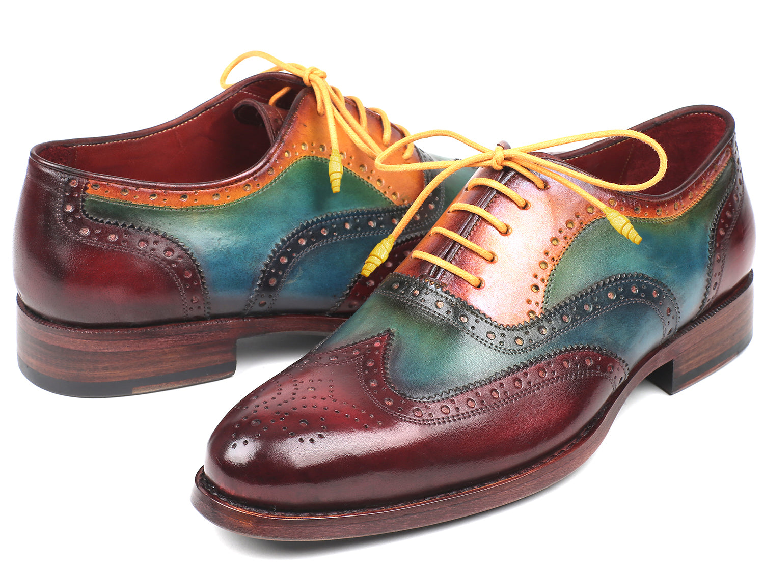 The Paul Parkman Wingtip Oxfords Goodyear Welted Multicolor - 027-MIX are multicolored leather wingtips with red, blue, green, and yellow sections, yellow laces, brogue perforations, and Goodyear welt construction by Paul Parkman.