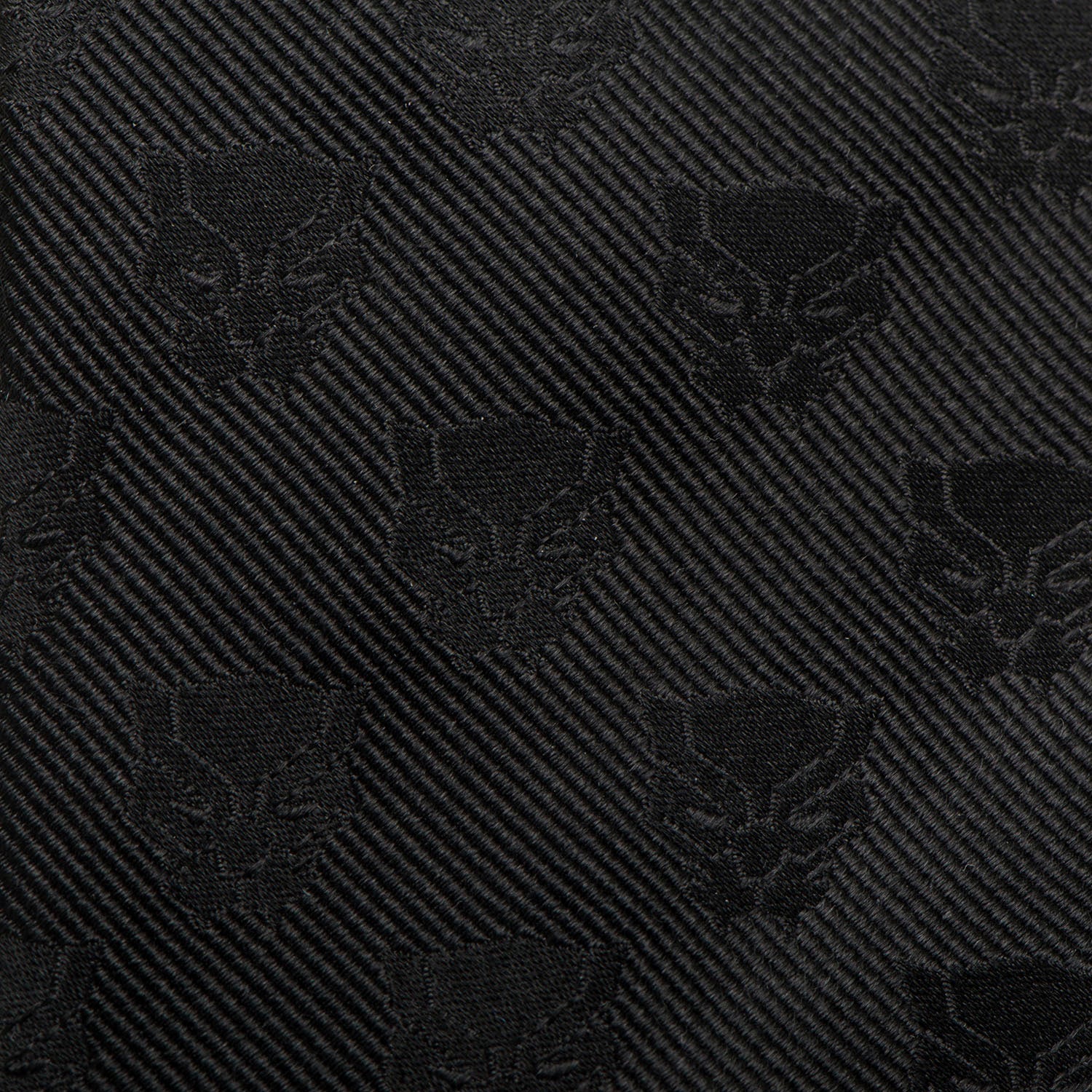 The Marvel Black Panther Men's Tie by Cufflinks.com is a rolled-up woven silk tie featuring a subtle, repeating pattern of the iconic mask emblem.