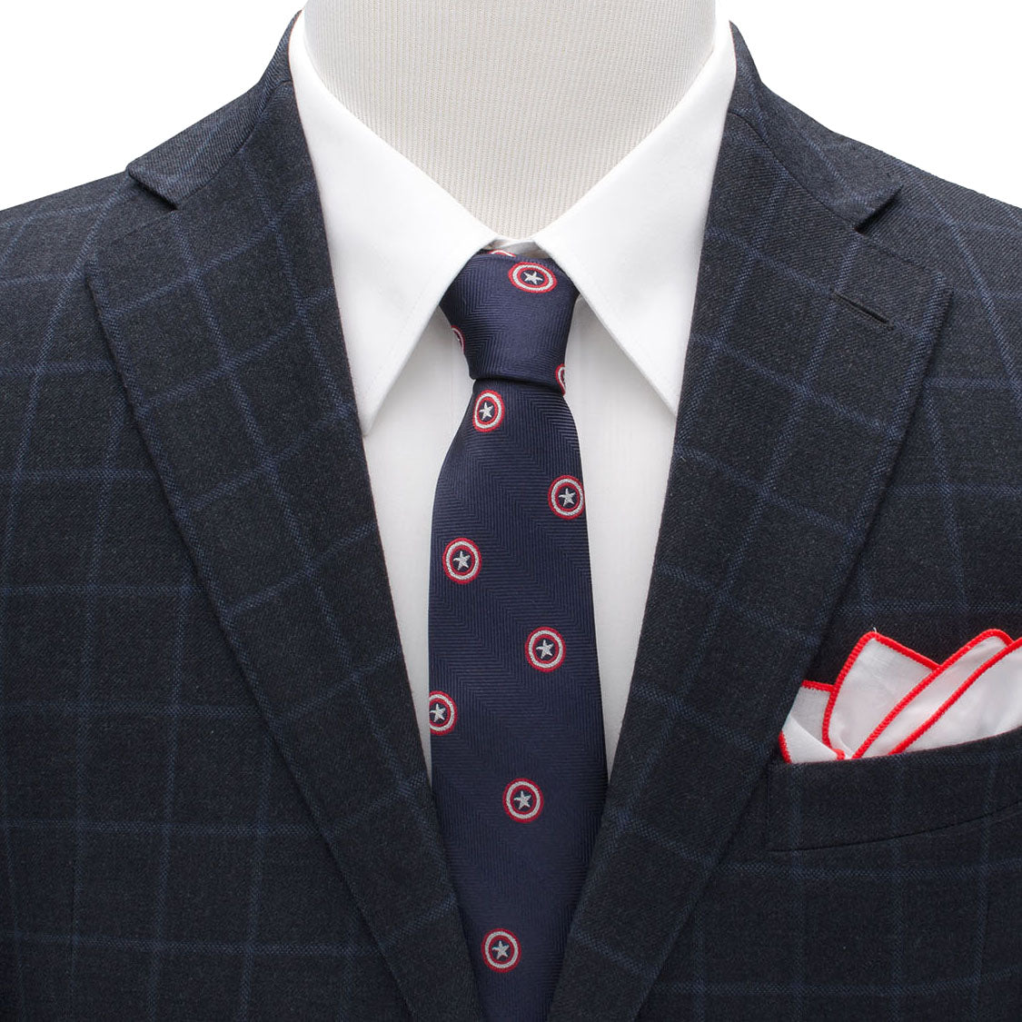 The Marvel Captain America Navy Tie from Cufflinks.com features a dark blue silk herringbone pattern decorated with small red and white outlined star emblems—perfect for any Marvel fan seeking an elegant, heroic accessory.