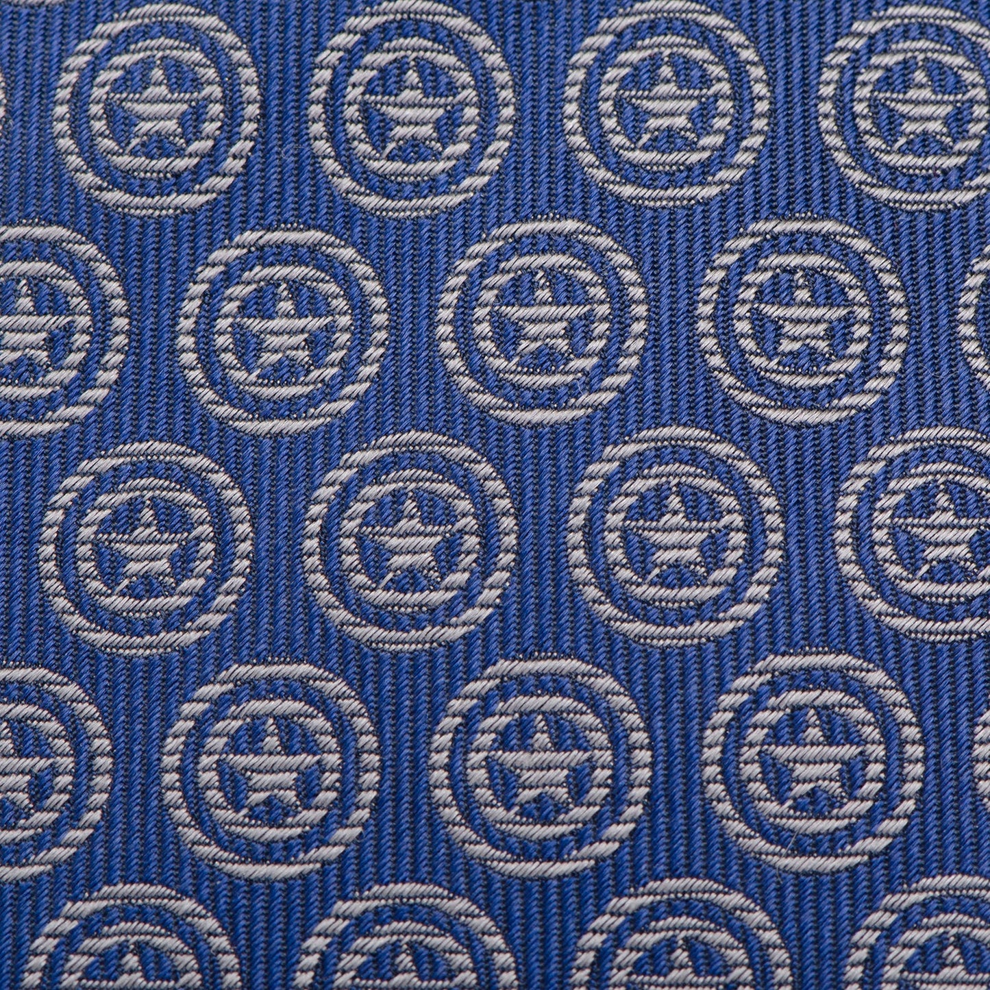 The Marvel Captain America Shield Blue Men's Tie by Cufflinks.com is a blue silk tie featuring a repeating shield pattern inspired by Captain America.