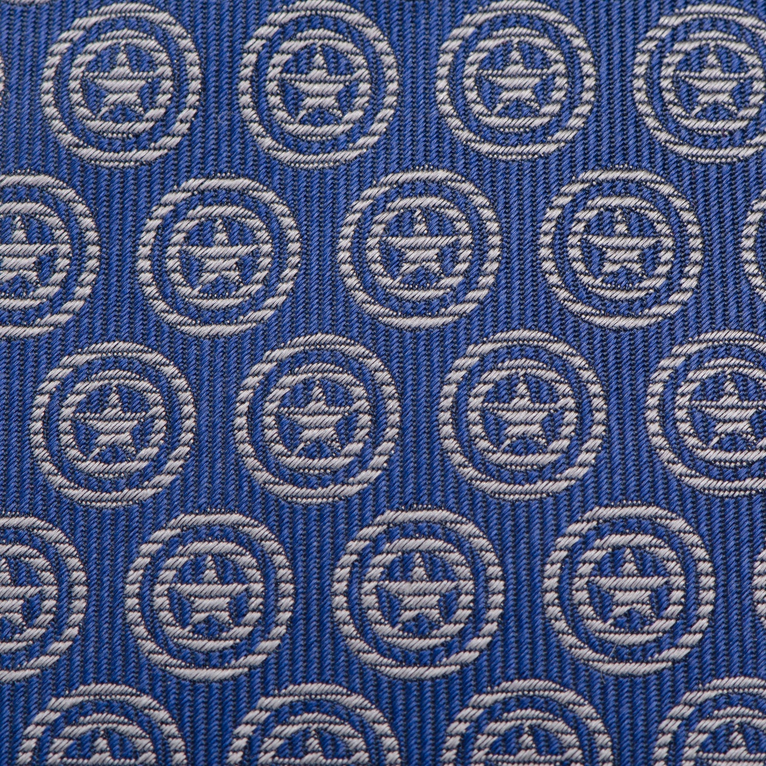 The Marvel Captain America Shield Blue Men's Tie by Cufflinks.com is a blue silk tie featuring a repeating shield pattern inspired by Captain America.