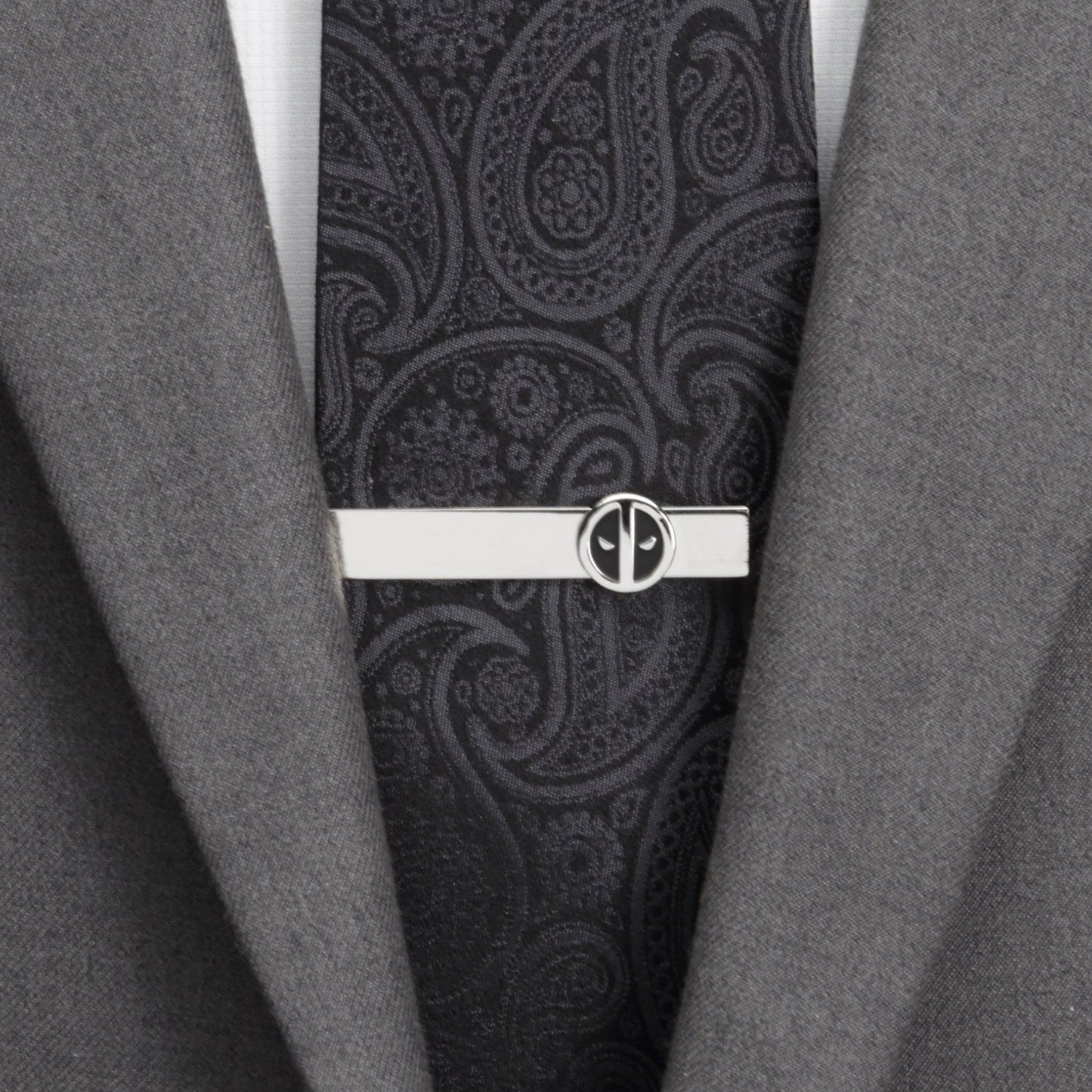 The Marvel Deadpool Cufflinks and Tie Bar Gift Set by Cufflinks.com features silver round cufflinks and a tie bar with black and white mask logos—ideal Marvel accessories for any fan.