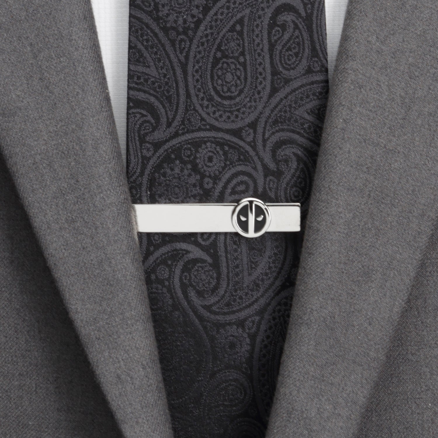 The Marvel Deadpool Cufflinks and Tie Bar Gift Set by Cufflinks.com features silver round cufflinks and a tie bar with black and white mask logos—ideal Marvel accessories for any fan.