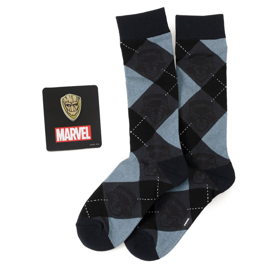 A pair of blue Guardians of the Galaxy Groot and Rocket argyle socks by Cufflinks.com, displayed next to a Marvel card with a gold mask, from the Marvel Groot Rocket Argyle Blue Gift Set.