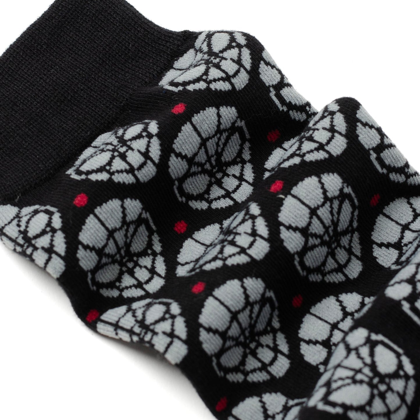The Marvel Spider-Man Dot Gray and Black Gift Set by Cufflinks.com includes black socks with a gray mask pattern and a Spider-Man lapel pin—ideal for any Spider-Man fan.