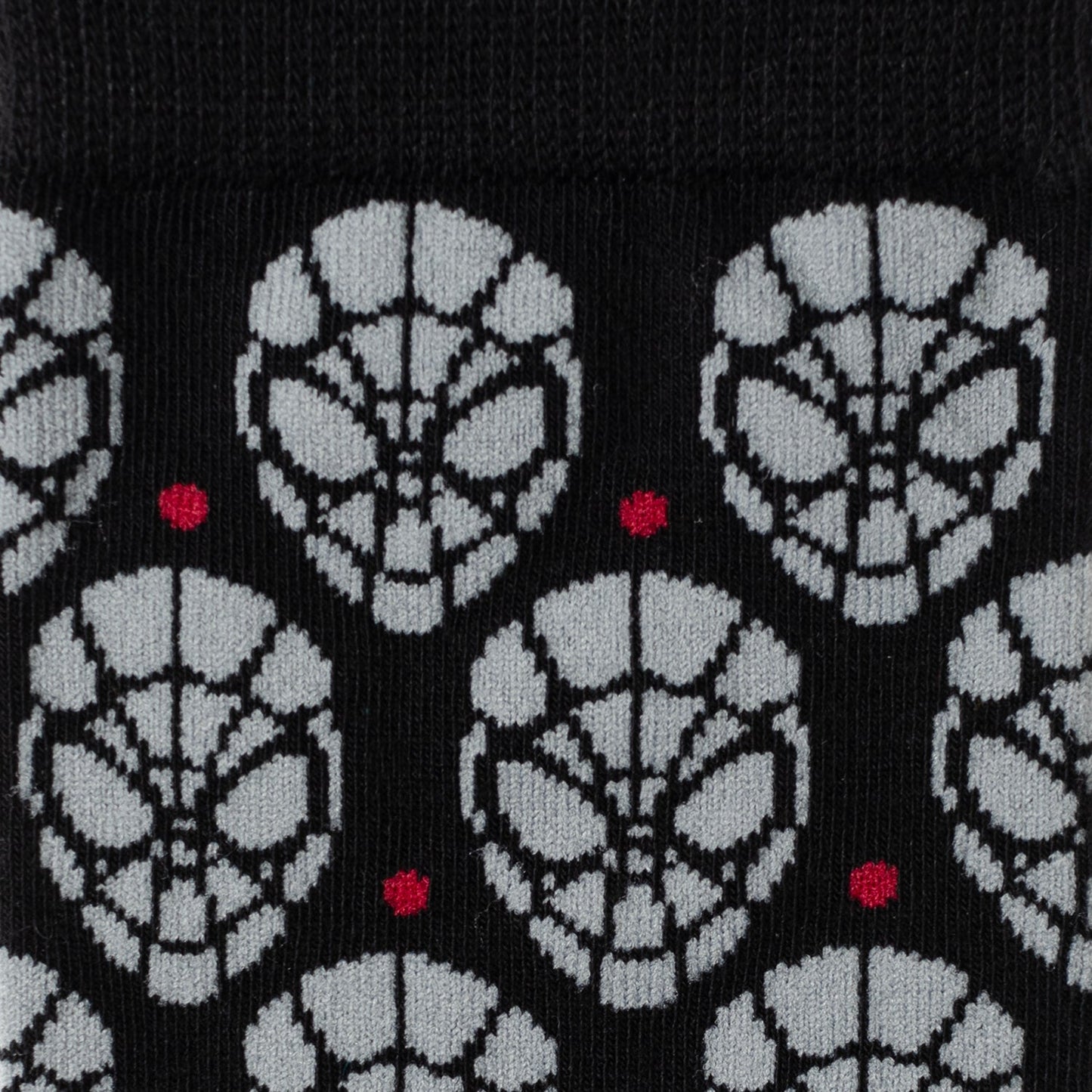 The Marvel Spider-Man Dot Gray and Black Gift Set by Cufflinks.com includes black socks with a gray mask pattern and a Spider-Man lapel pin—ideal for any Spider-Man fan.