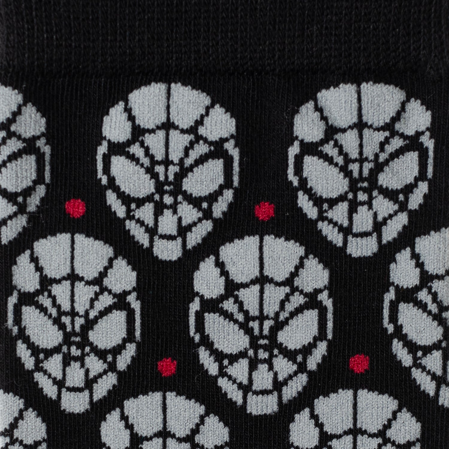 The Marvel Spider-Man Dot Gray and Black Gift Set by Cufflinks.com includes black socks with a gray mask pattern and a Spider-Man lapel pin—ideal for any Spider-Man fan.