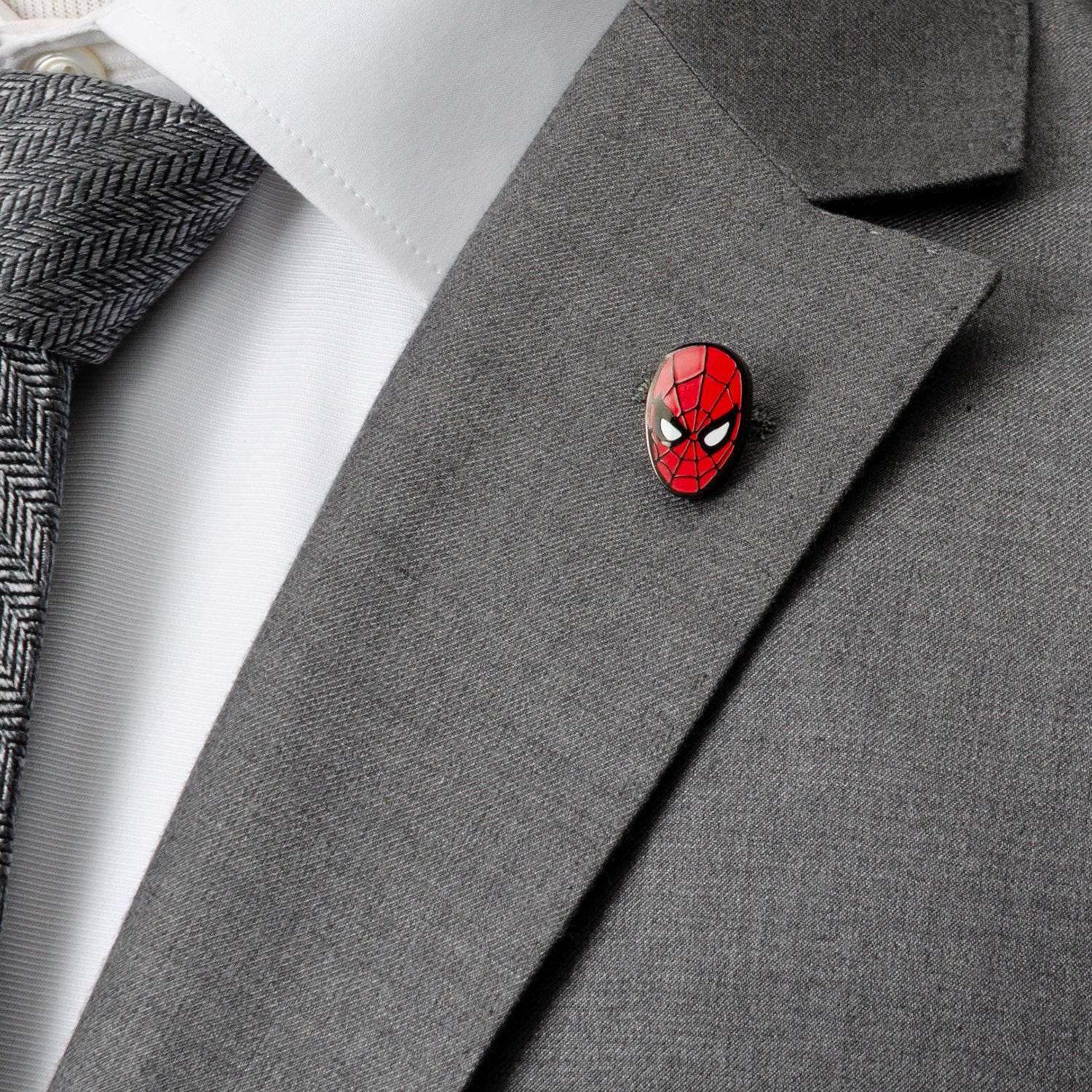 The Marvel Spider-Man Dot Gray and Black Gift Set by Cufflinks.com includes black socks with a gray mask pattern and a Spider-Man lapel pin—ideal for any Spider-Man fan.