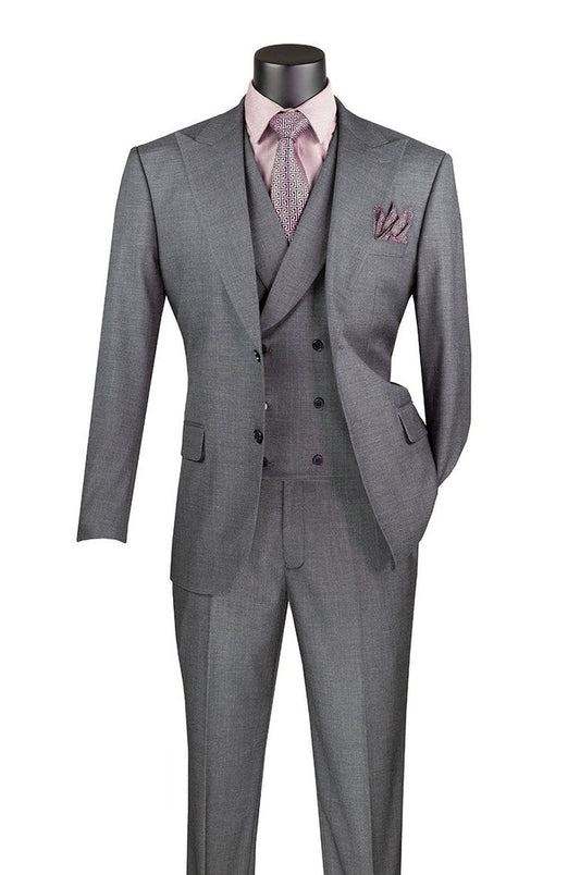 The Vinci Suits Modern Fit 3 Piece Suit in charcoal, featuring adjustable waistband pants, is displayed on a mannequin with a pink shirt, patterned tie, and matching pocket square.