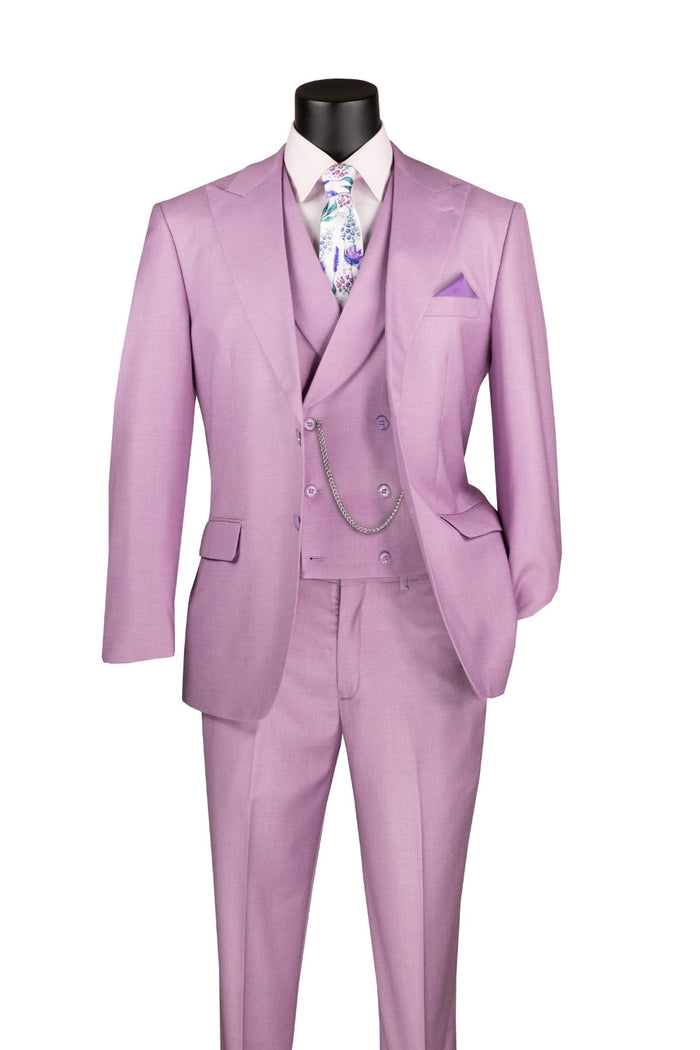Displayed on a mannequin, the Vinci Suits Modern Fit 3 Piece Suit in lavender includes a white shirt and floral tie, featuring a double-breasted vest, chain accessory, and adjustable waist band pants. It boasts a textured weave for a timeless yet modern appearance.