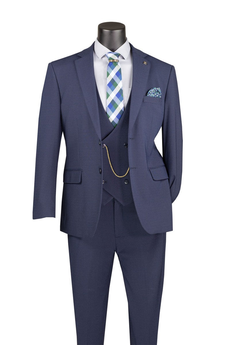 The Modern Fit Navy 3 Piece Suit with Vest and Adjustable Waistband Pants MV2K-3 by Vinci Suits is styled on a mannequin with white shirt, plaid tie, pocket square, and gold chain.