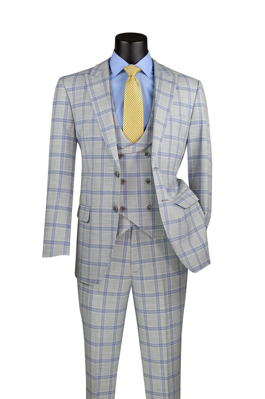 The Modern Fit Windowpane 3-Piece Suit by Vinci Suits, seen on a mannequin, includes a U-neck vest and features one sleeve tucked into a pocket. It is styled with a blue shirt and yellow tie, showcasing its light gray color with a subtle windowpane pattern for added flair.