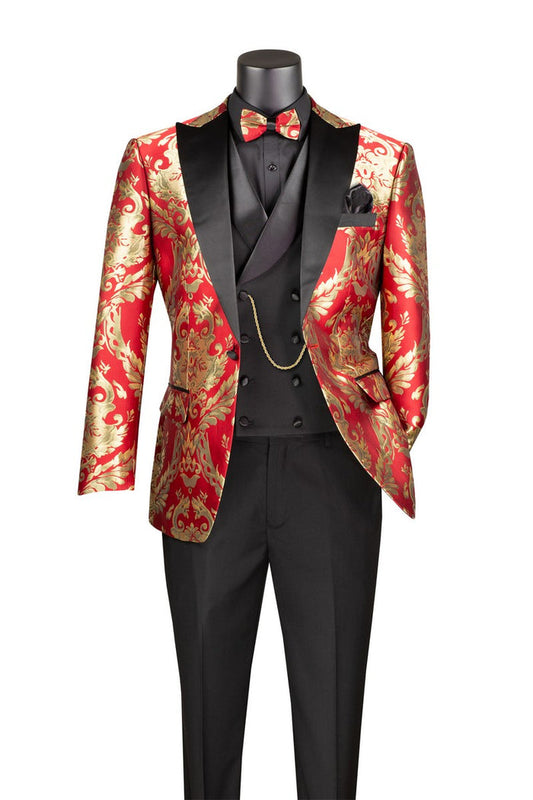 A mannequin displays the Vinci Suits' Modern Fit 3 Piece Suit Red MVJQ-1, featuring a red and gold brocade tuxedo jacket with black lapels, a black waistcoat, black trousers, paisley lining, a matching red bow tie, and a gold chain accent.