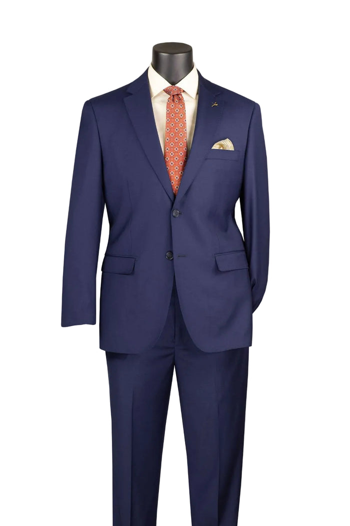 The mannequin displays the Modern Fit Blue 100% Wool Single Breasted 2-Button Suit MW100 by Vinci Suits with a cream shirt, patterned red tie, and cream pocket square.