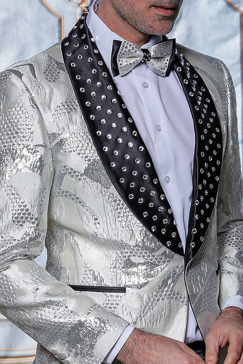 Man in a Manzini MZS-601 suit, featuring a metallic pattern and rhinestone satin lapel, paired with a bow tie.