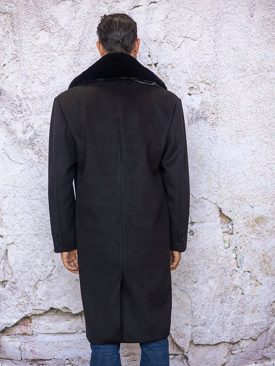 A man in an Insomnia MANZINI MZW-321 Black 3/4 Faux Fur Collar Winter Coat stands against a textured, off-white wall.