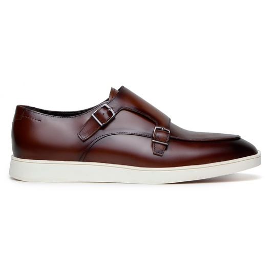 The BELVEDERE Belvedere - Marcio Hybrid Double Buckle Dress Shoe in cognac features two buckles and a white rubber sole, crafted in Brazil and displayed in a side profile view against a white background.