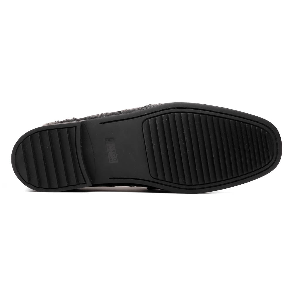 The Milan Black by Marco Di Milano is a black crocodile-pattern leather loafer with a metallic logo detail on the strap and red interior lining, epitomizing luxury men’s footwear.