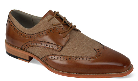 The Giovanni Nico Tan Leather Shoes by GIOVANNI are brown and beige wingtip brogues with intricate perforations, laces, a wooden heel, and a textured fabric section.