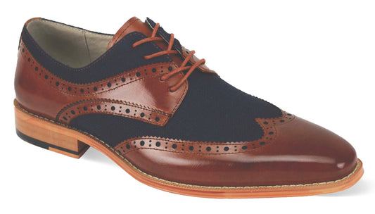The Giovanni Nico Whiskey/Navy Leather Shoes from GIOVANNI are exquisite wingtip dress shoes that boast intricate brogue detailing and a wooden sole, finished with elegant lace closures.