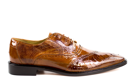 The BELVEDERE Nino dress shoe, shown in profile on a white background, is crafted from genuine ostrich leg and eel leather in Ant. Camel, featuring decorative stitching and a pointed toe.