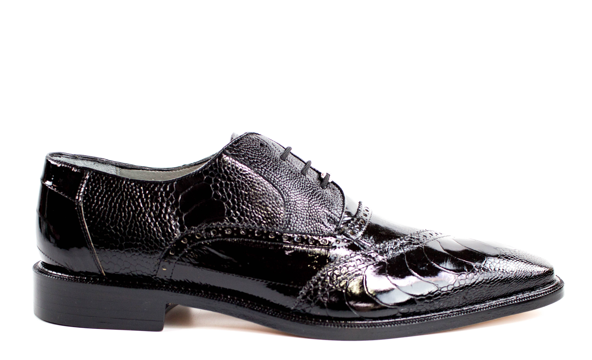 The BELVEDERE Nino dress shoe in black features genuine ostrich leg and eel leather, brogue detailing, a pointed toe, and low heel. Shown from the side on a white background.