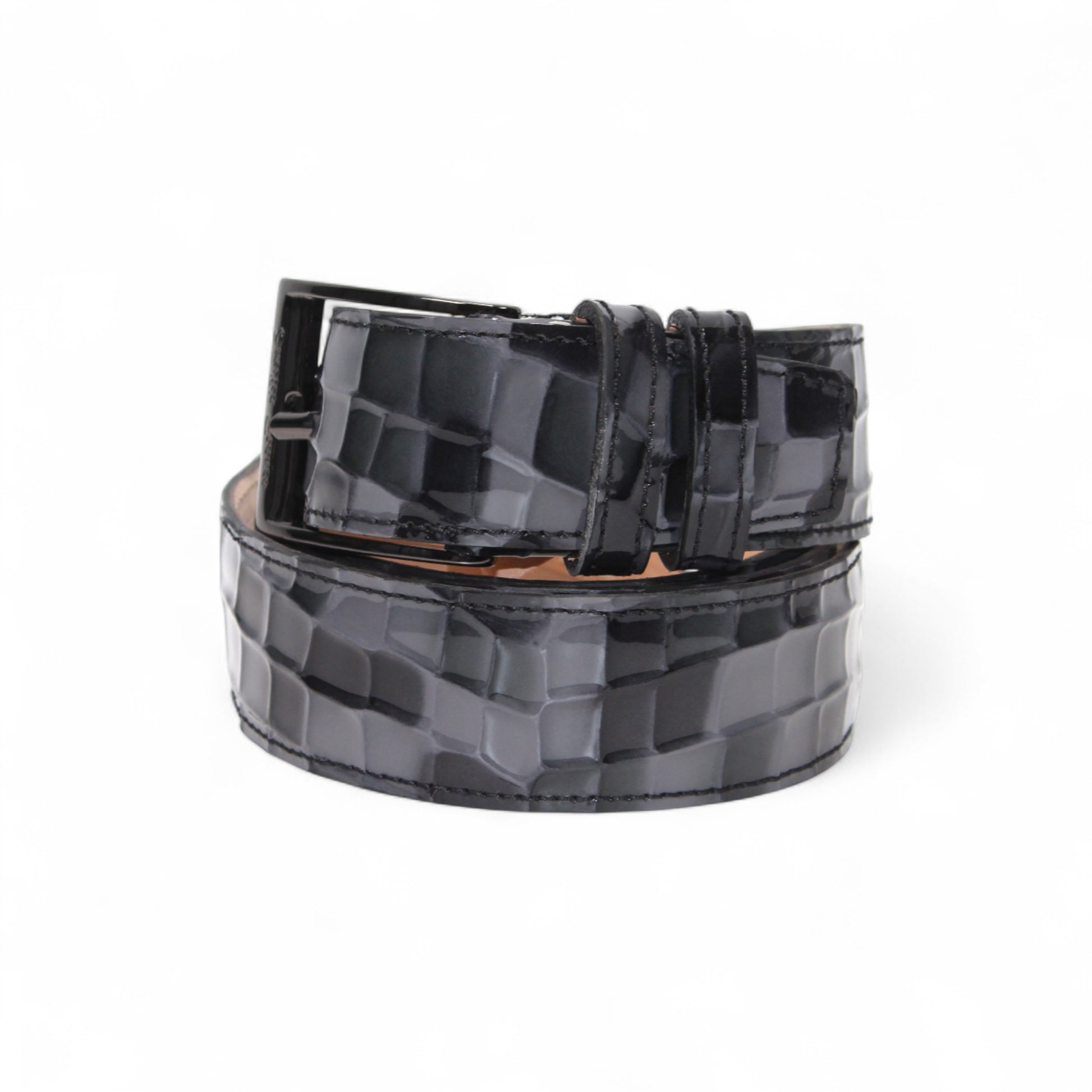 The Matiste Grey Leather Belt NS1 by Matiste features hand-finished Italian leather with a textured surface and a large round buckle engraved with a lion's head design.