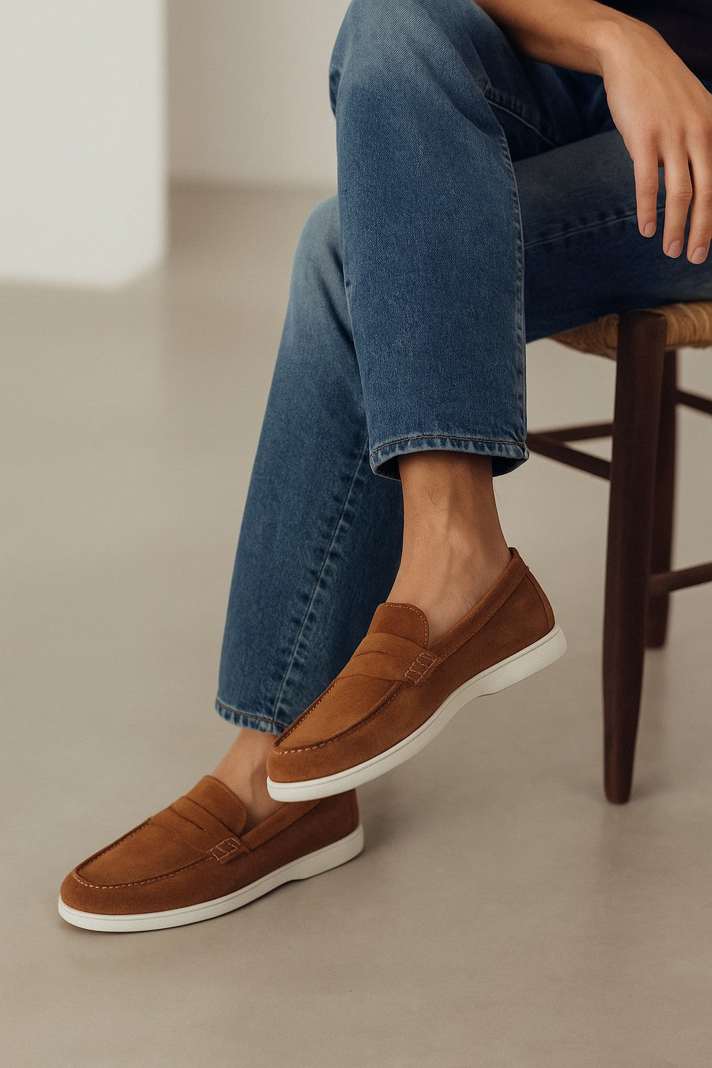 The BELVEDERE Belvedere - Niko Italian Suede Penny Loafer in Bourbon features brown suede, a white rubber sole, stitched side detail, and a low heel. This lightweight dress shoe is displayed on a plain white background.