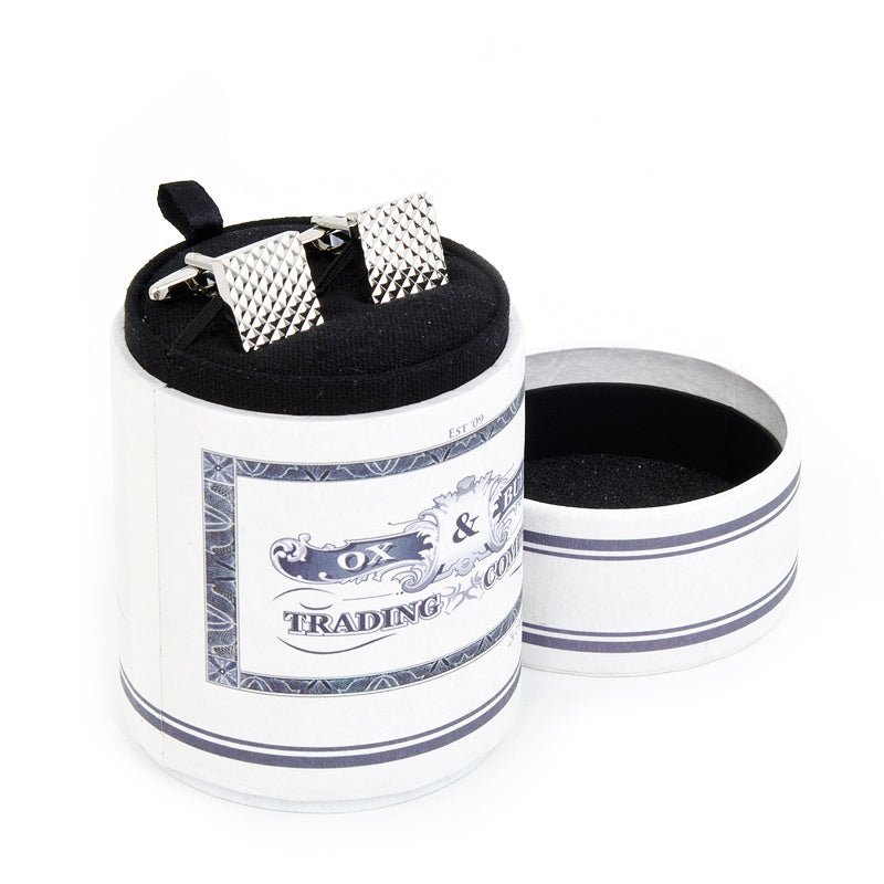 The Apex Square Cufflinks by Cufflinks.com feature a silver, rhodium-plated finish and a textured geometric pyramid pattern, making them a refined accessory for formal occasions.